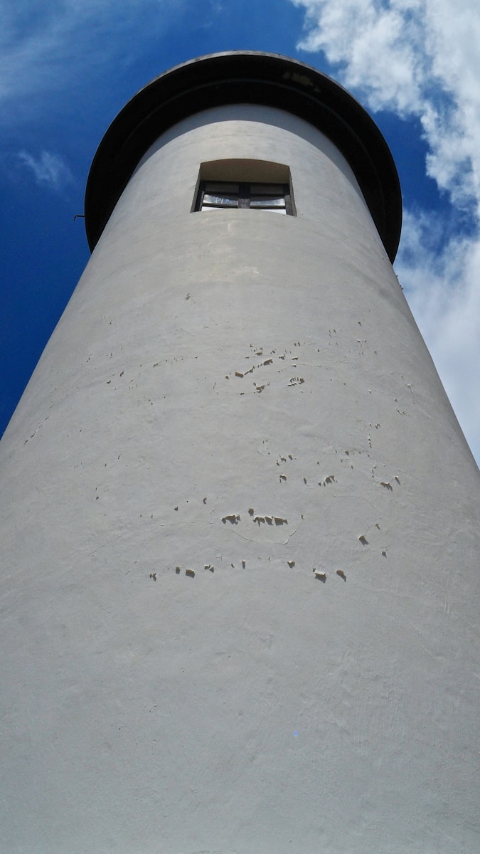 white lighthouse under blue sky